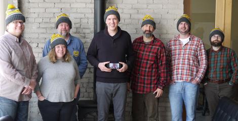 members of Electric Citizen, all wearing team hats