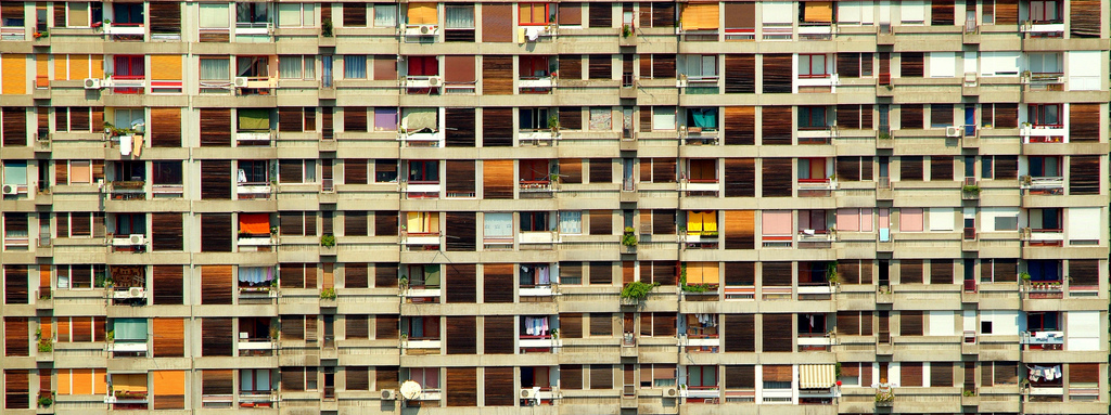 outside of a large apartment, and windows look like a series of blocks