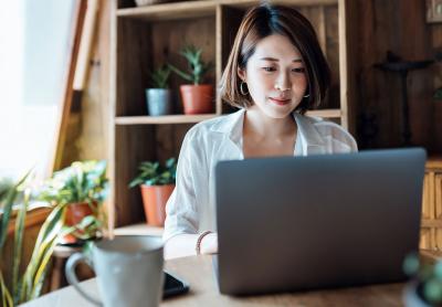woman in home office working on a laptop