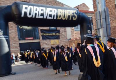 graduates of university in black gowns 
