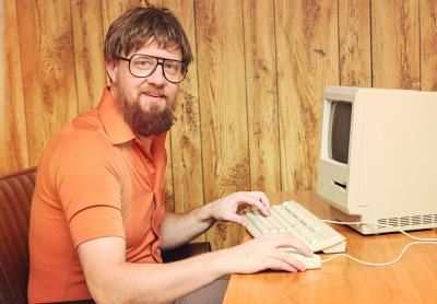 1980s style office worker with old computer