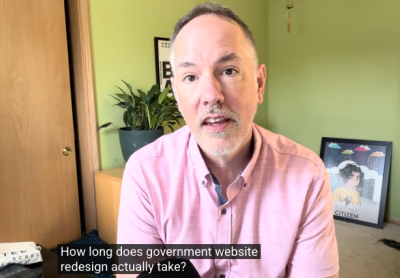 Dan speaking in video still from "How Long Does a Government Website Redesign Take?"