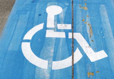 handicap symbol painted on a parking spot