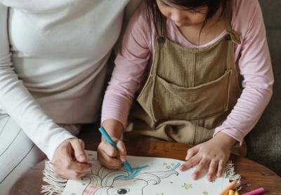 mother and daughter drawing together