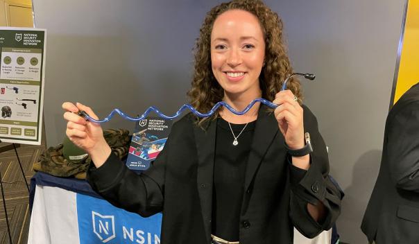 medical student displaying work at conference