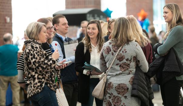 Leading Age members talking at a conference