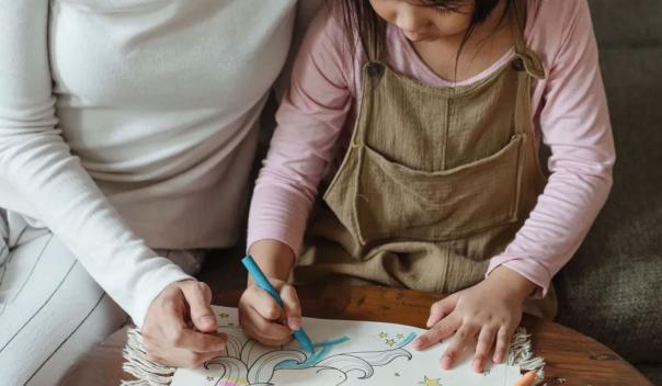 mother and daughter drawing together