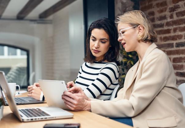Two woman designers focusing on a screen