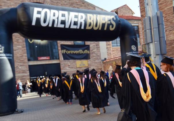 graduates of university in black gowns 