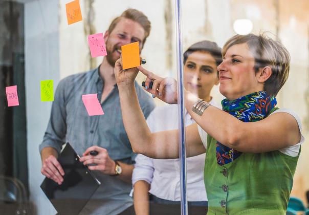 group of work colleagues discussing strategy in a meeting