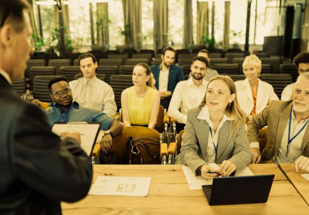 group of business professionals gathered in a conference room