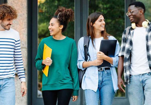 young adult college students talking together outside