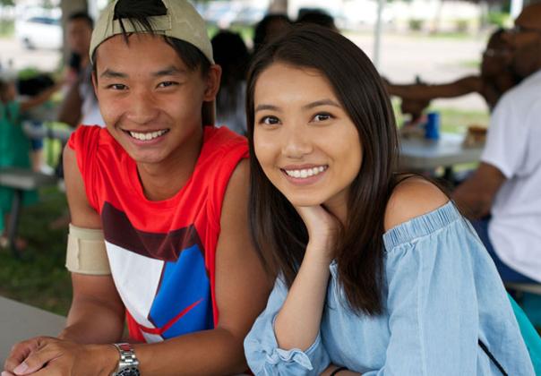 young adult asian american couple at an outdoor picnic