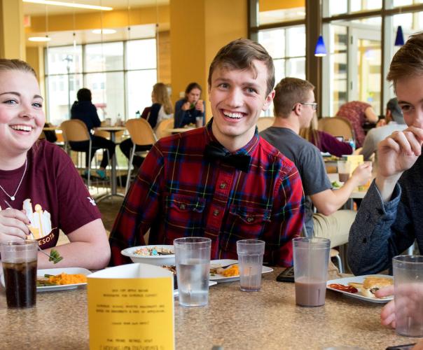 students hanging out together in a dining hall