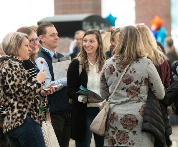 Leading Age members talking at a conference