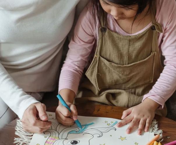 mother and daughter drawing together