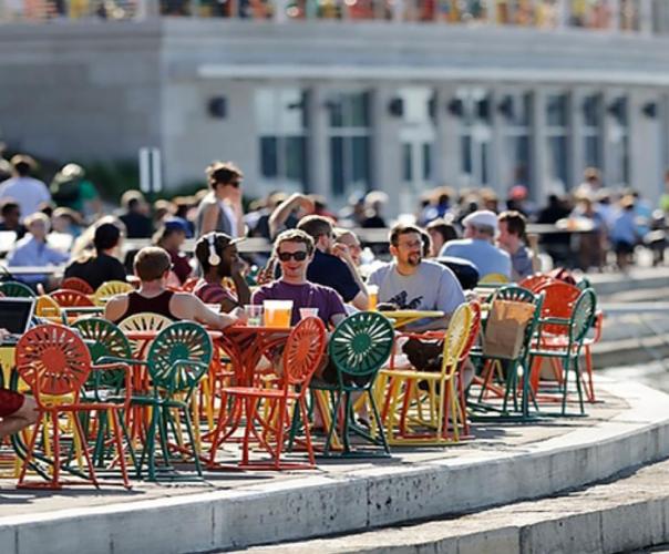 people sitting at tables outside of the Wisconsin Union 
