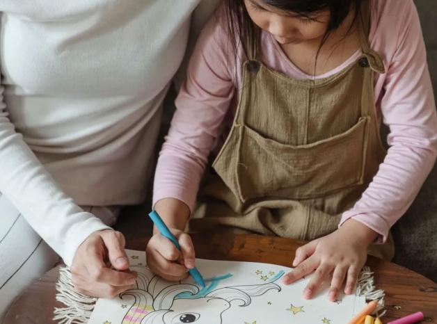mother and daughter drawing together