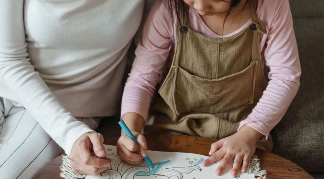 mother and daughter drawing together