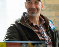 Wilbur and his laptop, wearing Electric Citizen hat