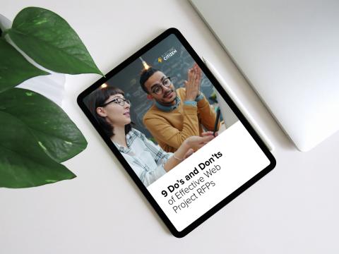 digital tablet on a white surface showing the cover of the report on the screen