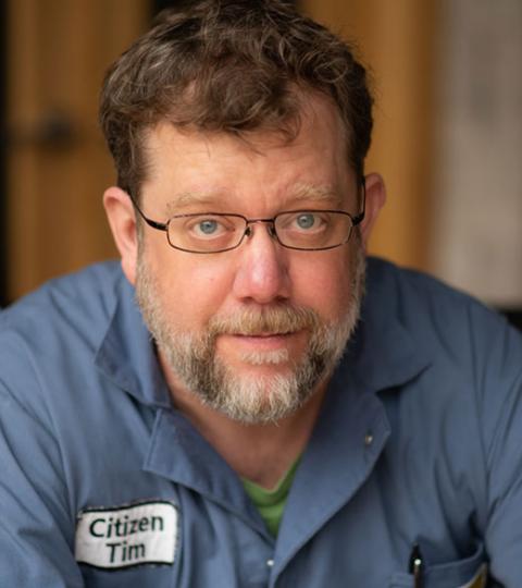 photo of Tim Broeker wearing his Electric Citizen blue jumpsuit